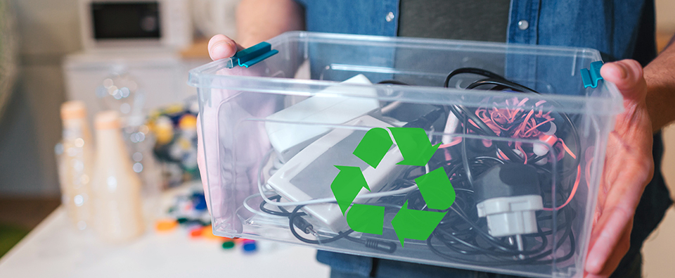 recycling concept. an electronic waste in recycling contaner close up. responsible man is protecting environment while sorting the waste at home